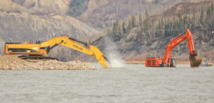 Excavation crews dredge the Peace River near Old Fort in April as part of fish enhancement work just downstream of the Site C dam site. A posting at the Peace Island Park boat launch in Taylor advises boaters of the work.   Photo By Matt Preprost 